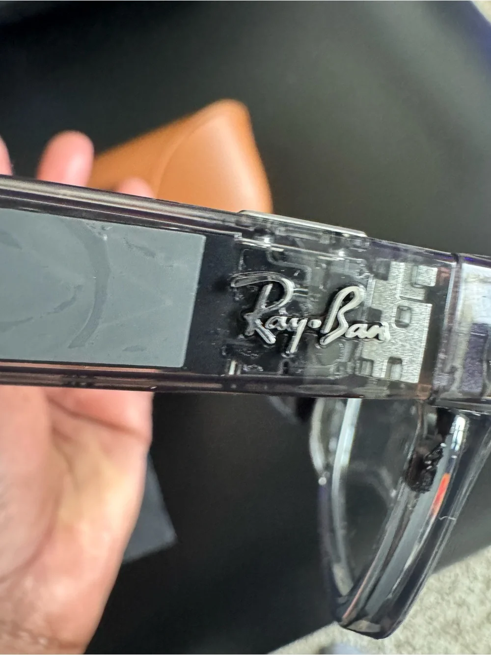 Meta Ray-Ban AI transitional Sunglasses with charging case.